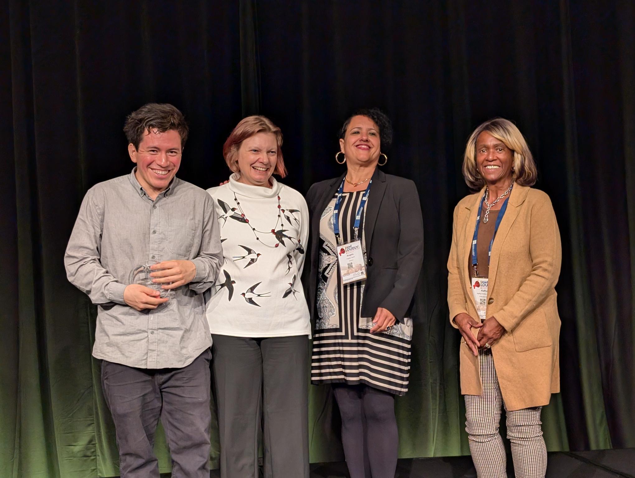 A group of people standing on a stage